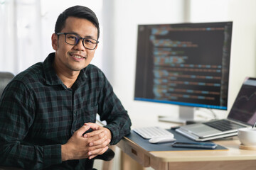 software develper working on laptop at home office. programmer working develop web application. soft