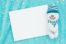 Blank White Greeting Card With Snowman On Blue With Snowflakes
