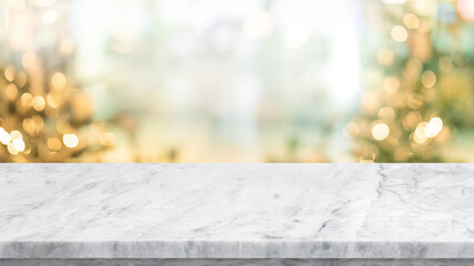 Wall Mural - Selective focus.Empty marble table top with blur christmas tree,ornament background.