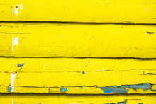 Several Wooden Boards Painted In Yellow Color. Wooden Beams Used For The Exterior Of Houses In The Caribbean.