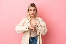 Young Caucasian Woman Isolated On Pink Background Making The Gesture Of Being Late