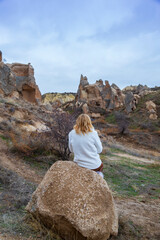 Volcanic rock landcsape of Fairy tale chimneys in Cappadocia with blue sky on background in Goreme, Nevsehir, Turkey