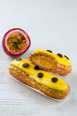 Poster - Beautiful and tasty eclair with yellow glaze and mango-passion fruit flavor