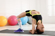 © New Africa - Cute little girl doing gymnastic exercise indoors