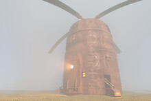 Fantastic Old Rusty Unidentified Flying Object With A Propeller In The Fog. 3D Illustration