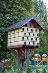 A large Wooden Birdhouse Condo with many windows in Annecy, France