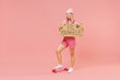 © ViDi Studio - Full body happy young woman with bright dyed rose hair in rosy top shirt hat stand on skateboard hold card sign be yourslef title test isolated on plain light pastel pink background studio portrait