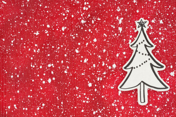 Christmas tree on red with snowflakes background