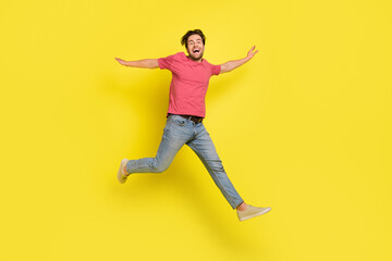 Sticker - Full body photo of hooray brunet young guy run wear red t-shirt jeans shoes isolated on yellow background