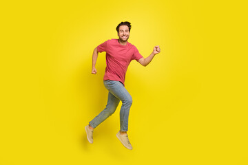 Sticker - Full size photo of impressed beard young guy run wear red t-shirt jeans sneakers isolated on yellow background