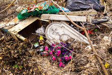 Rubbish And Old Gravestones Piled Up On The Outskirts Of A Cemetery