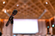 © whyframeshot - Microphone in meeting room for a conference.Public speaking backgrounds, Close-up the microphone on stand for speaker speech presentation stage performance