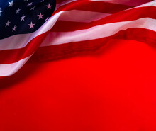 American Flag Against Red Background