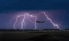 USA, Florida, Miami, Commercial Jet Landing In Thunderstorm