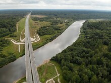 Federal Highway Bridge River In Summer Forest. Modern Straight Road Track. Moscow Saint Petersburg Motorway M11 Neva In Russia. Aerial Drone View. Flying Over. 
