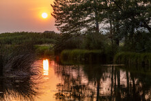 USA, Idaho, Bellevue, Sunset Reflecting In Spring Creek