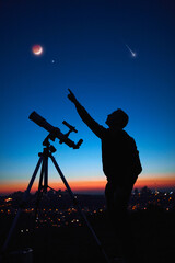 Wall Mural - silhouette of a man and telescope under the starry skies.