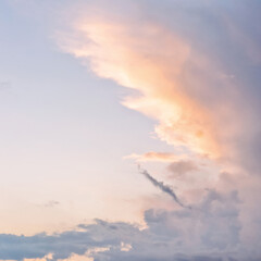 Wall Mural - dramatic cloudy pastel colored sunset sky