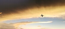 Plane And Sunset
