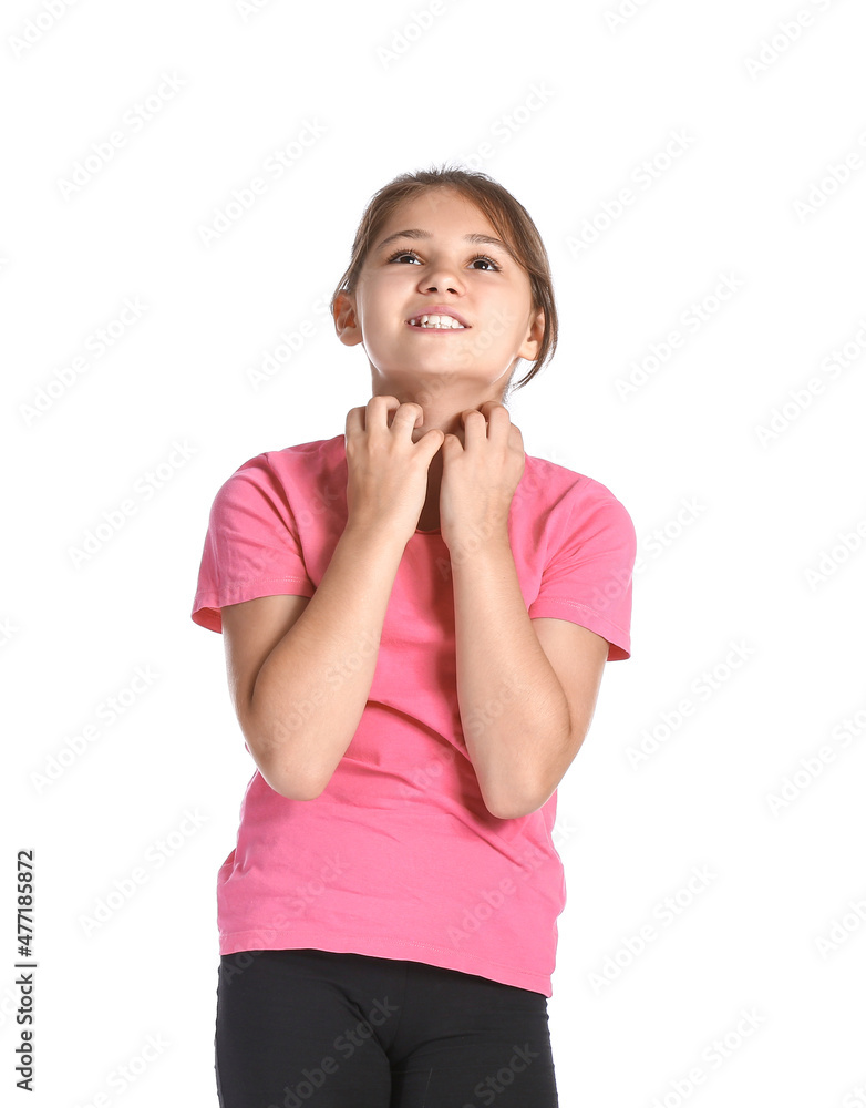 Little girl scratching herself on white background