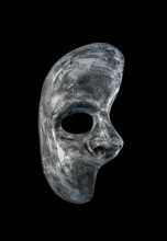 Old Dirty Phantom Of The Opera Half Face Mask Isolated On Black Background With Clipping Path