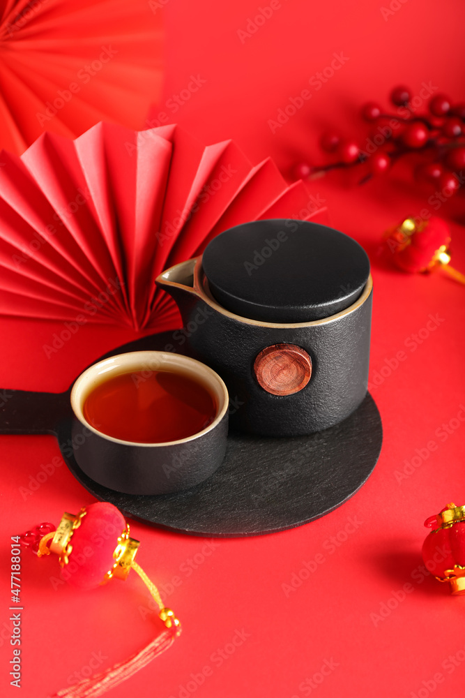 Tasty Chinese tea on color background