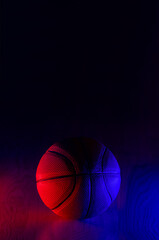 Wall Mural - Basketball ball isolated on dark background. Blue neon banner. Vertical sport theme poster, greeting cards, headers, website and app