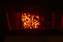 Burning Coals In A Solid Fuel Boiler. Heating Of A Residential Building In Winter.