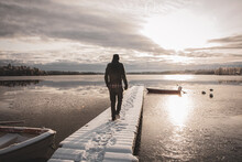 Man Walking On Snowy Bridge 10