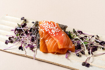 Wall Mural - salmon sashimi with microgreens  and sesame