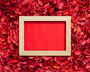 Wall Mural - Aromatic mix of potpourri of dried flowers. A bunch of dry potpourri flowers on a red background. Romantic Valentines day composition. Flat lay. Love concept.