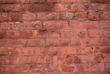 Old Red Brick Wall. The Texture Of Weathered Grungy Brickwork. Masonry Background.