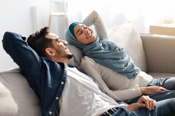 Wall Mural - Relaxed muslim family resting after moving to their new house