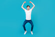 © Tetiana - Full body photo of young excited man good mood rejoice victory triumph success isolated over blue color background