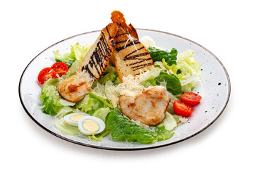 Wall Mural - Caesar salad with chicken on a white decorative plate. A classic salad.