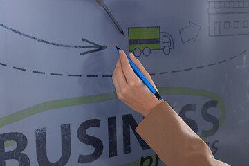 Sticker - Business trainer with pen using interactive board, closeup