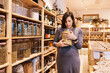 © ADDICTIVE STOCK - Pregnant female standing with jar with cereal in hands in eco shop