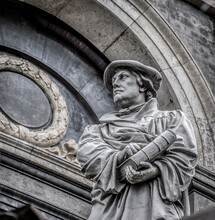 Monument Of The Reformer Martin Luther With A Bible In His Hand In Front Of Marble Church  In Copenhagen