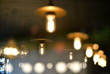 A Pattern Of Burning Light Bulbs In The Foreground And Background
