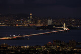 Fototapeta  - San Francisco lit up the night with holidays lights via Berkeley Hills.