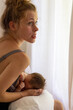 © Alexander - portrait of a beautiful young mother breastfeeding her baby