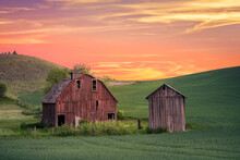 Rural Farm Scene At Sunset With Red Barn Viewed From The Palouse In Washington State