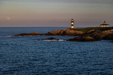 Wall Mural - Full moon on the coast of Galicia, with lighthouse, natural rock arches, etc!