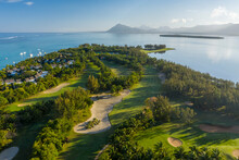 Aerial View Of A Golf Club Along The Coastline Near The Public Beach, Le Morne, Mauritius.