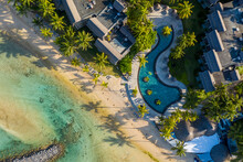 Aerial View Of A Swimming Pool Along The Coast Near The Beach In A Luxury Hotel, Bel Ombre, Mauritius.