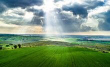 Aerial View Of Sunbeam Over A Green Wheat Field, Ruhama Badlands, Israel.