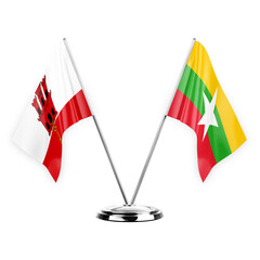 Two table flags isolated on white background 3d illustration, gibraltar and myanmar