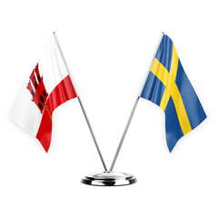 Two table flags isolated on white background 3d illustration, gibraltar and sweden