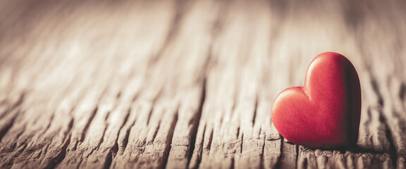 Wall Mural - one red wooden heart on rustic table with vintage effect - valentine's day