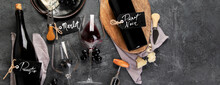 Red Wine Assortment With Appetizers On Gray Background.